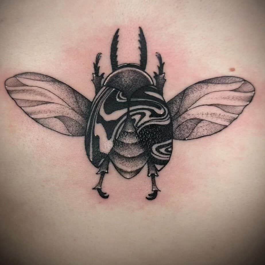 Beetle with intricate linework and abstract wings