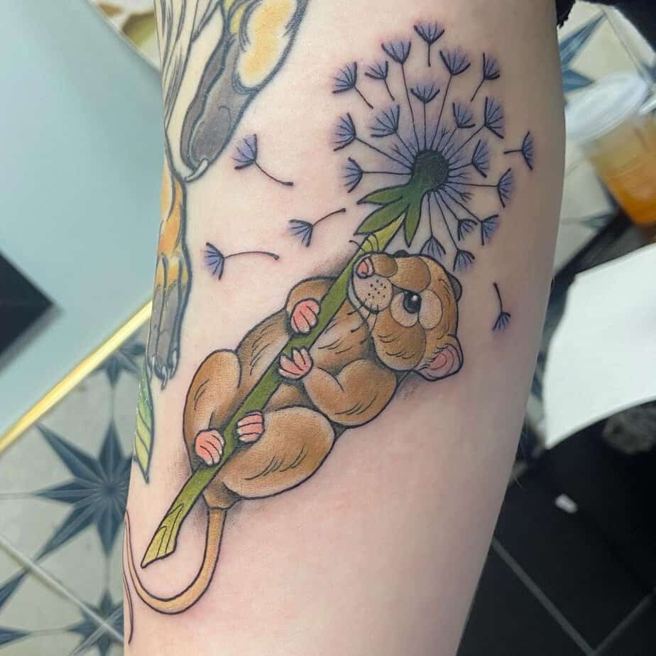 Mouse clutching dandelion
