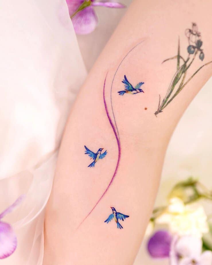 Dancing bluebirds and floral elegance