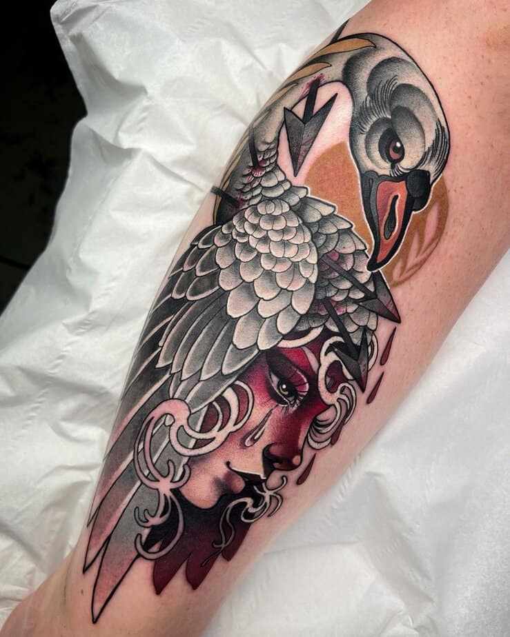 Neotraditional swan tattoo with woman's face