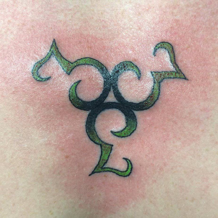 Green-lettering 333 tattoo