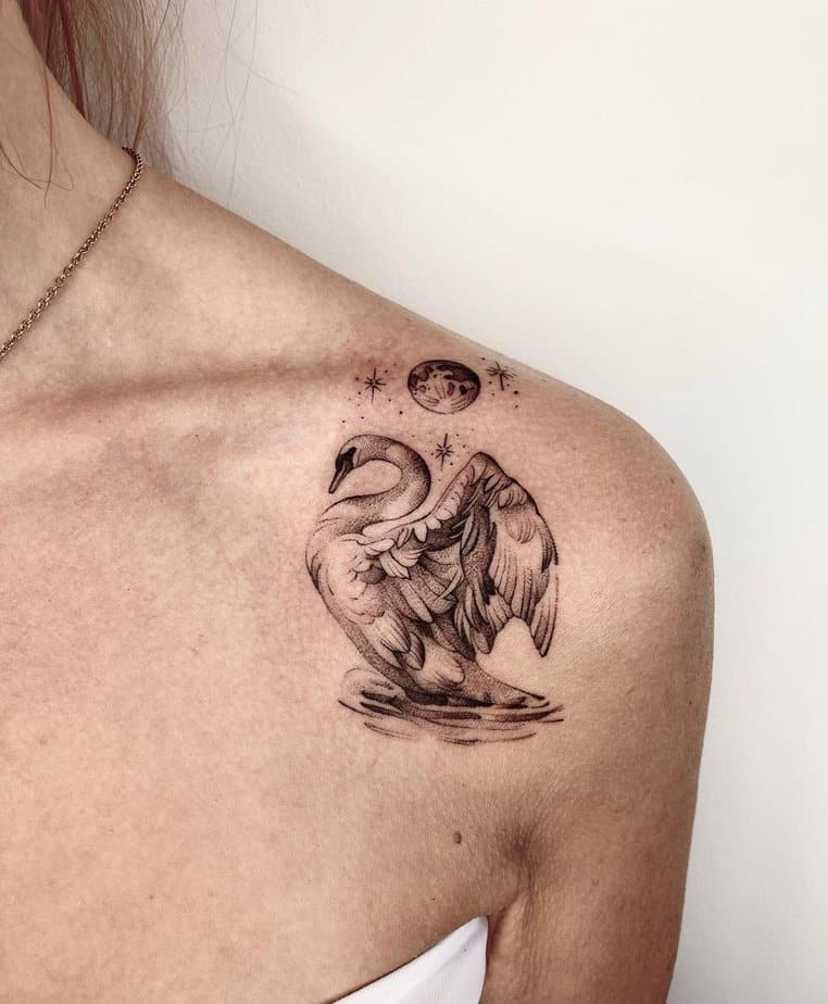 Moon and swan shoulder tattoo