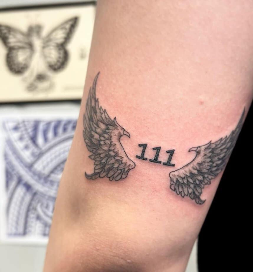 Winged 111 tattoo