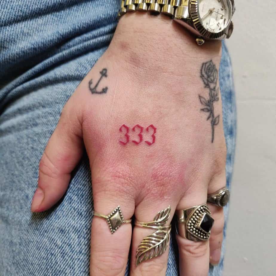 Hand placement 333 tattoo