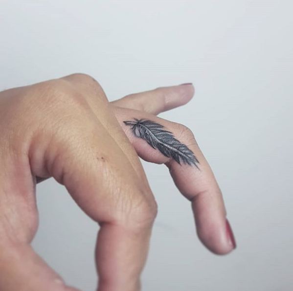 14. Bold feather on the side of the finger