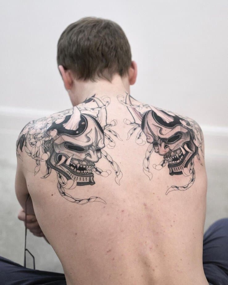 Symmetrical back tattoo with two Hannya masks