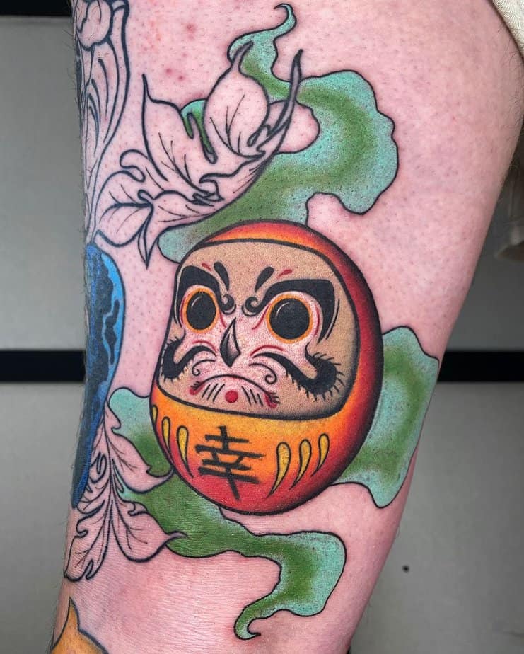 16. Cheerful-Daruma-tattoo-