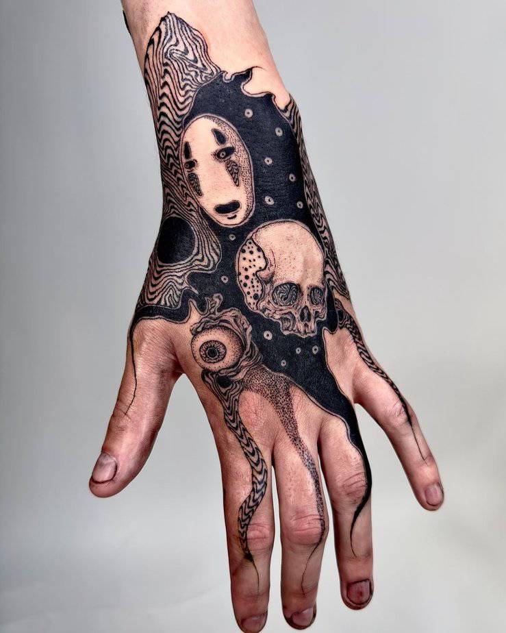 No-Face hand tattoo with intricate patterns and a skull