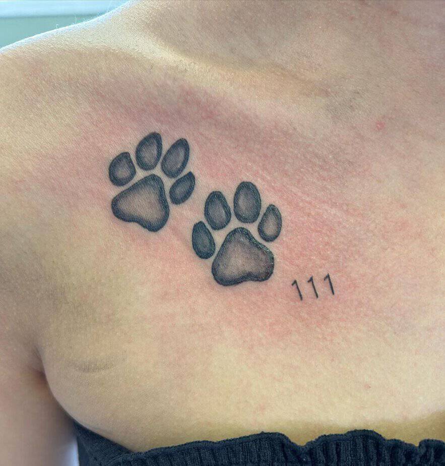 Paw prints and 111 tattoo