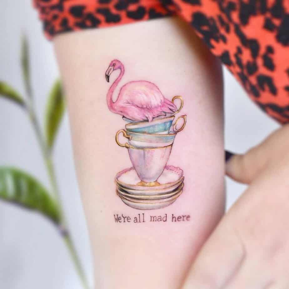 Stack of teacups topped with a flamingo and playful lettering