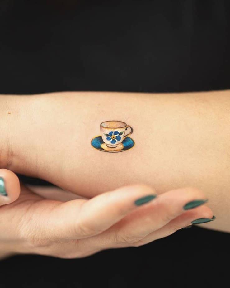 Small forearm teacup with deep blue floral detail