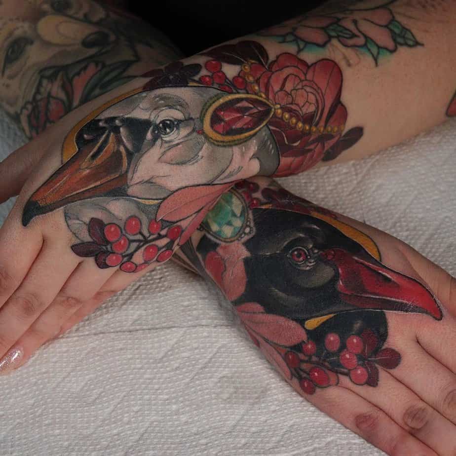 Colorful swan tattoos on both arms