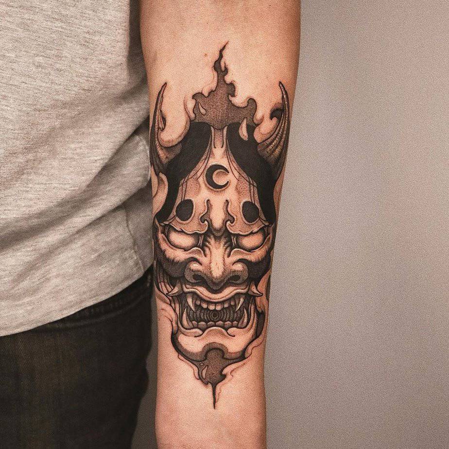 Forearm Hannya tattoo with a crescent moon on its forehead