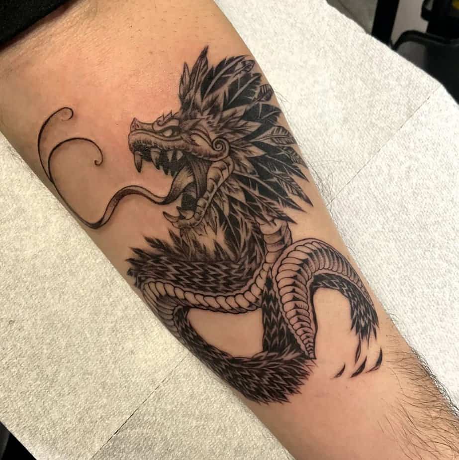Fearsome feathered serpent tattoo