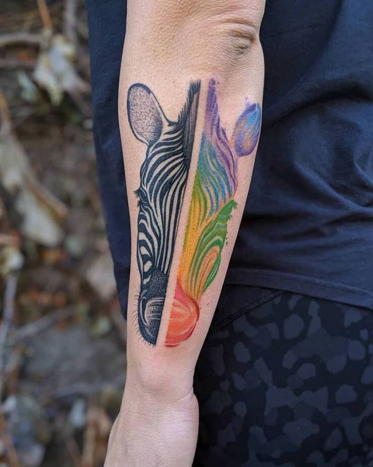 Zebra stripes merging into a rainbow tattoo