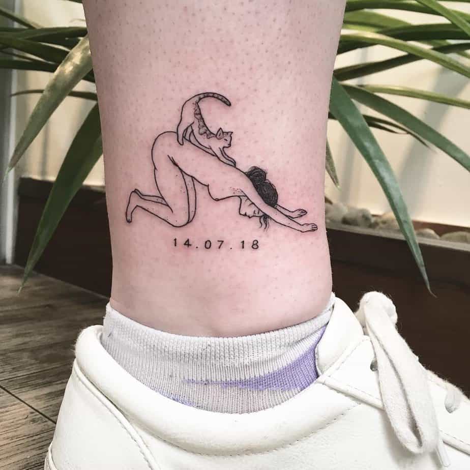 Woman and cat in yoga pose