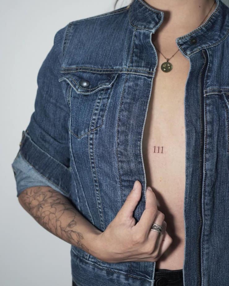 Simple 111 chest tattoo