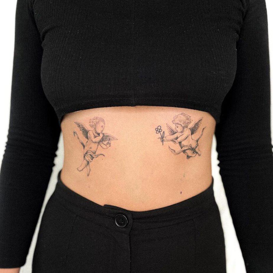 Cherub stomach tattoo