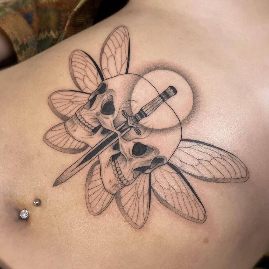 Skulls stomach tattoo