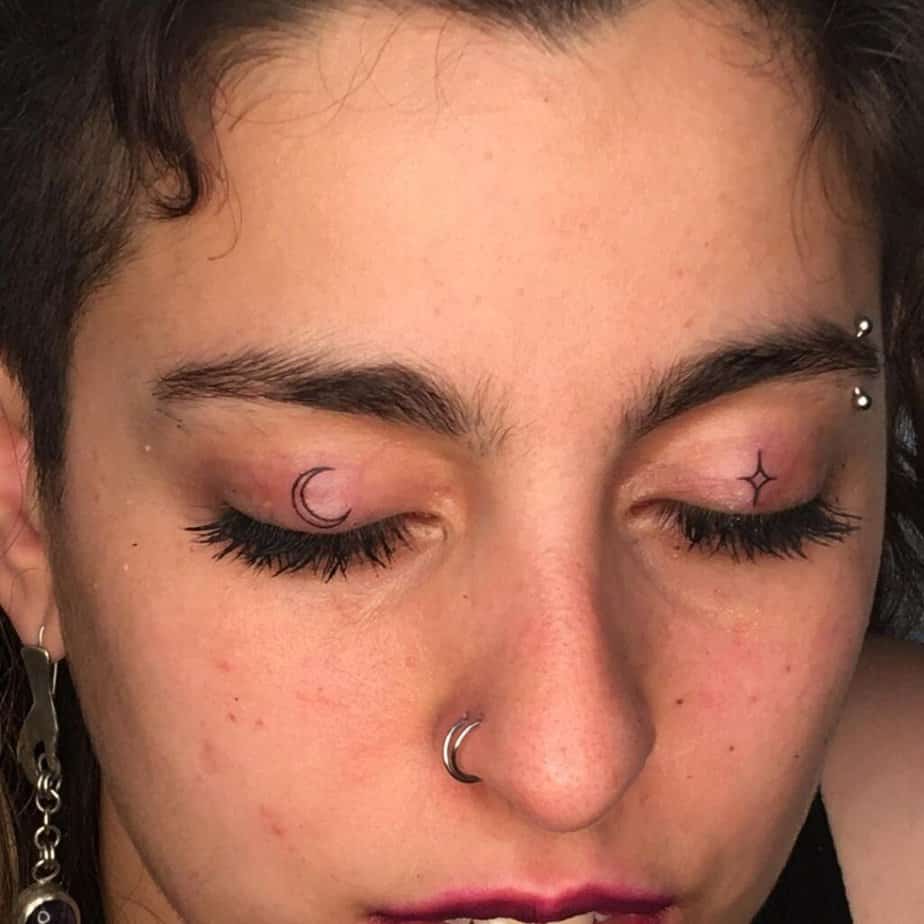 1. A star and moon eyelid tattoo