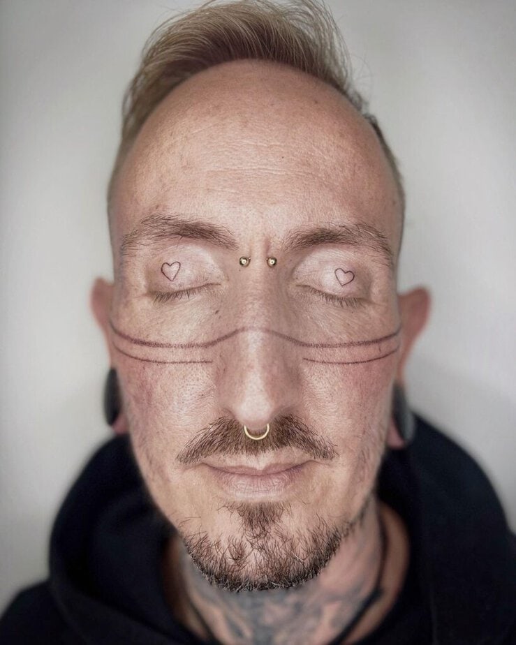 12. A tattoo of two fine-line hearts