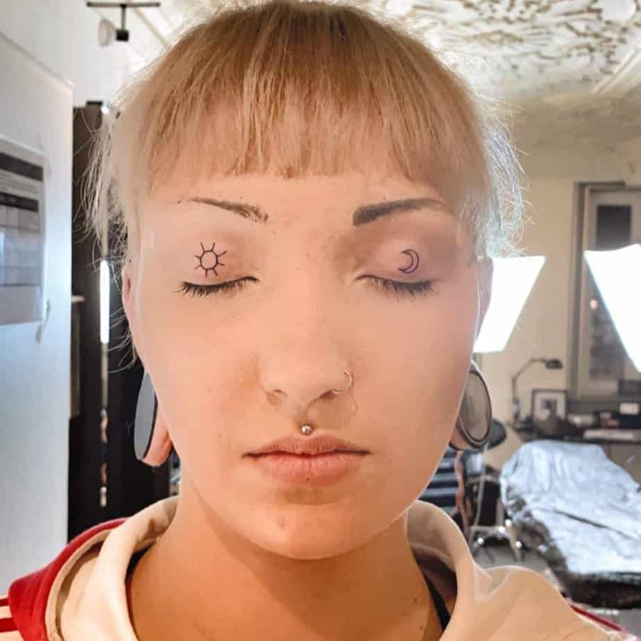 16. A sun and moon eyelid tattoo