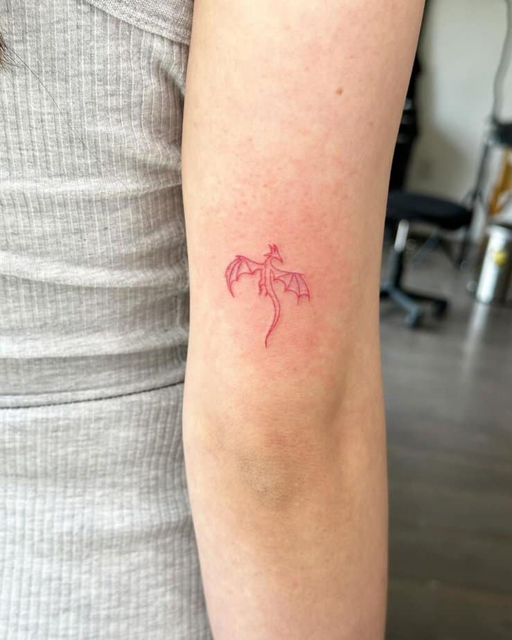 Red ink fine-line tattoo