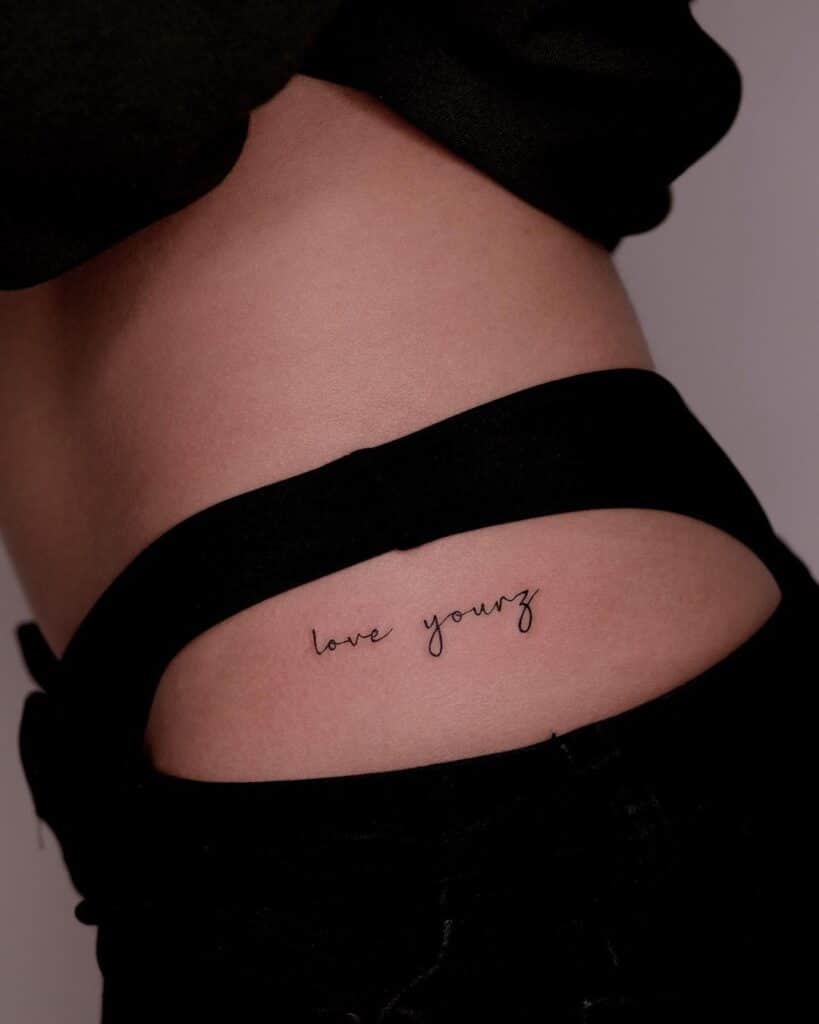Fine-line lettering tattoo