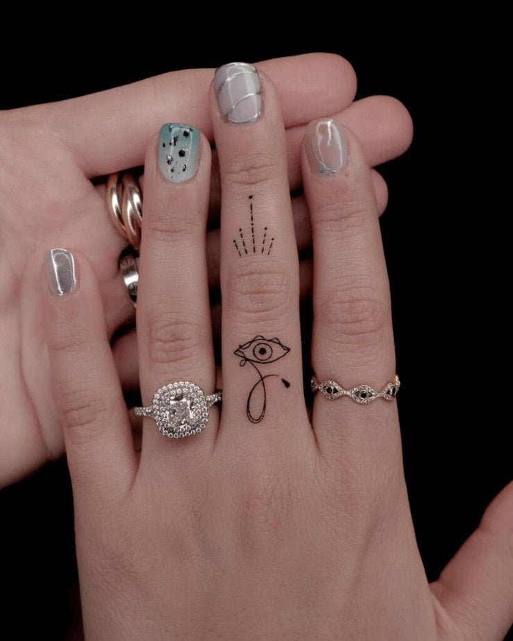 Evil eye fine-line tattoo