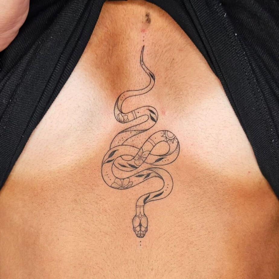 Fine-line snake tattoo