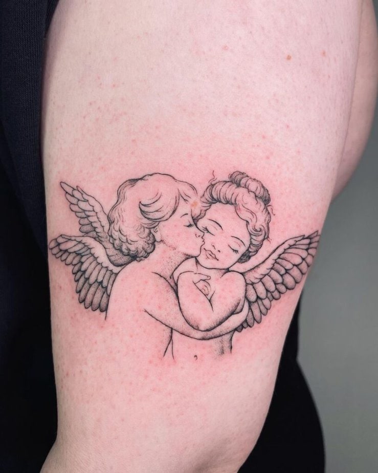 Cherubs kissing tattoo