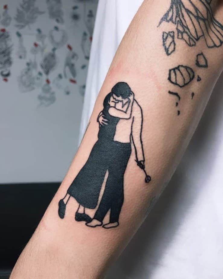 Passionate kiss blackwork tattoo