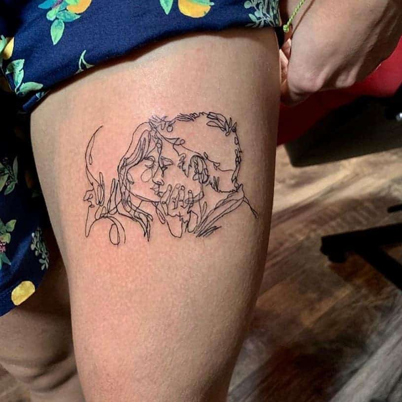 Sketch-style kiss tattoo