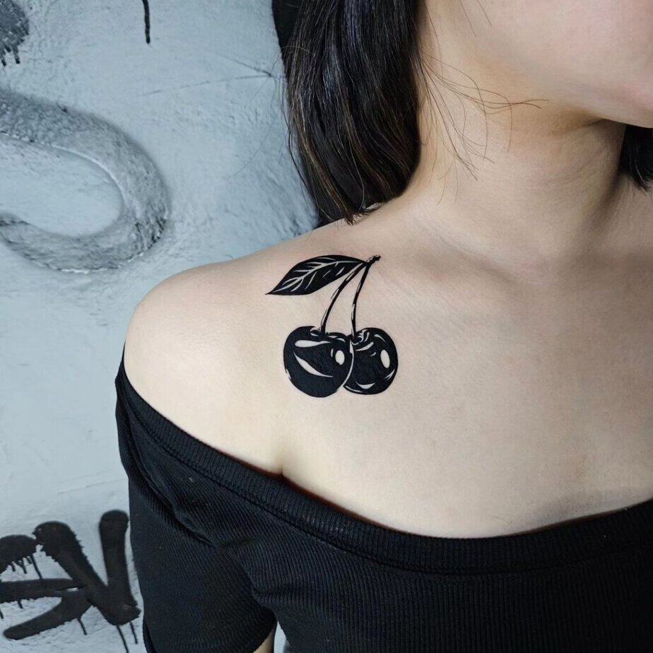 10. Edgy cherry tattoo