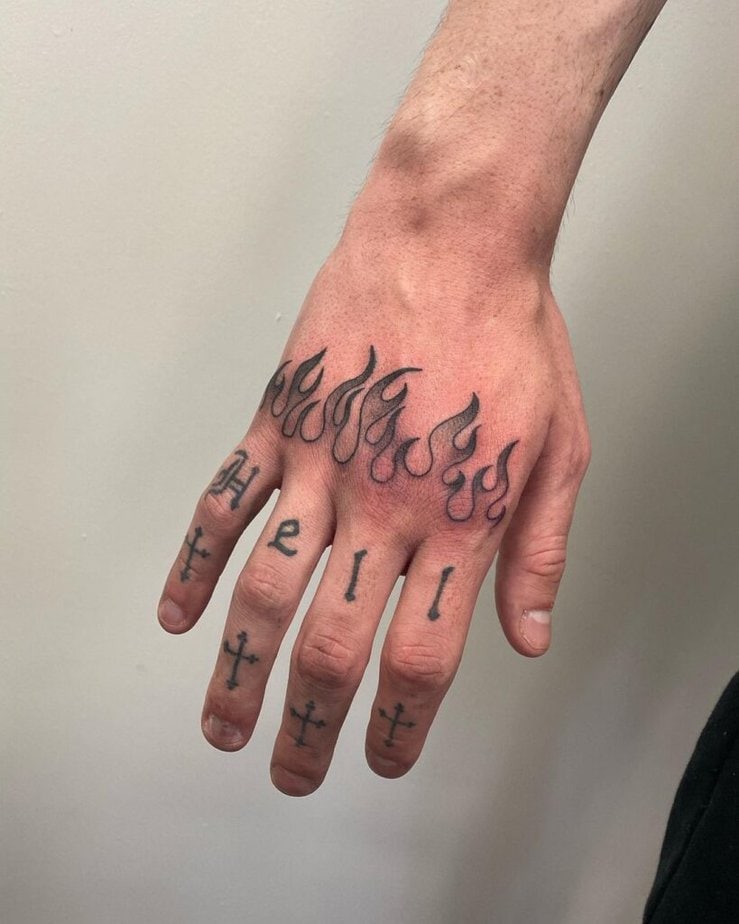 7. Religious knuckle tattoo