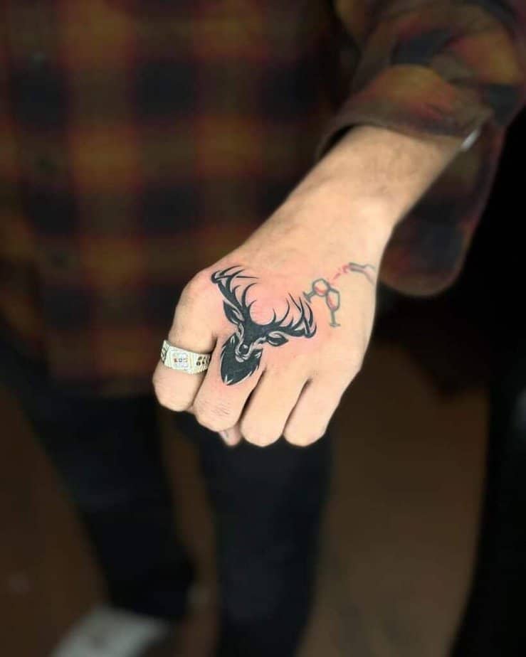 12. A deer tattoo on the knuckles