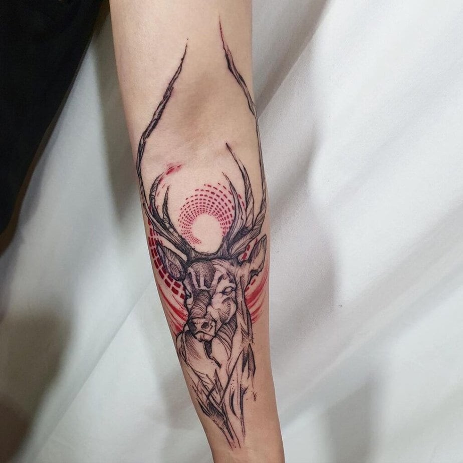 2. A black and red ink deer tattoo