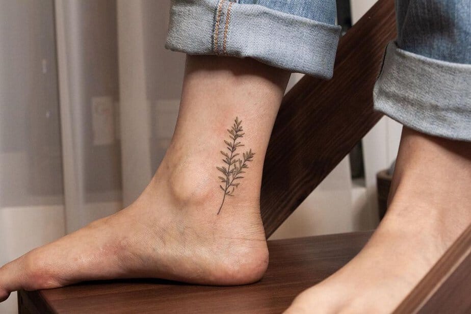 A simple rosemary tattoo design for the ankle