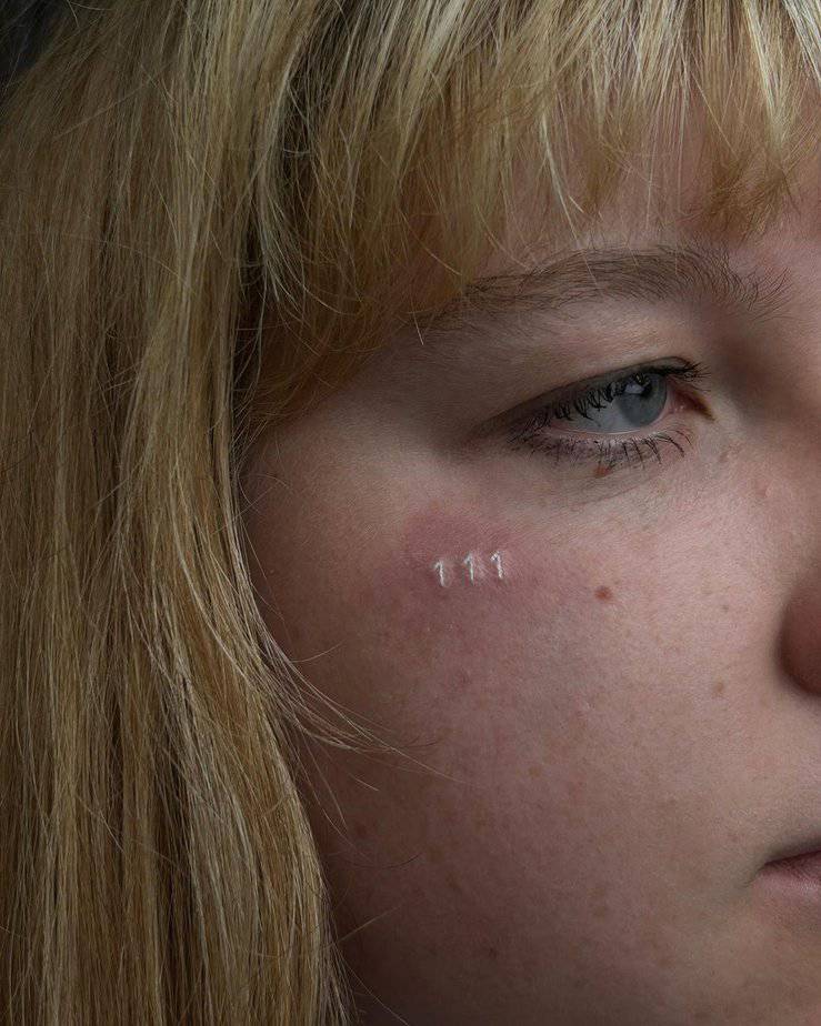 Subtle 111 facial tattoo