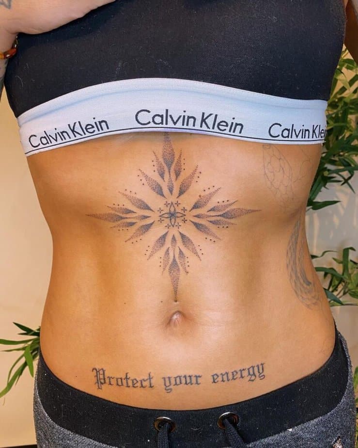 10. A dotwork stomach tattoo
