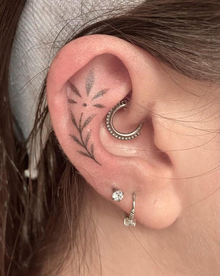 17. A dotwork ear tattoo