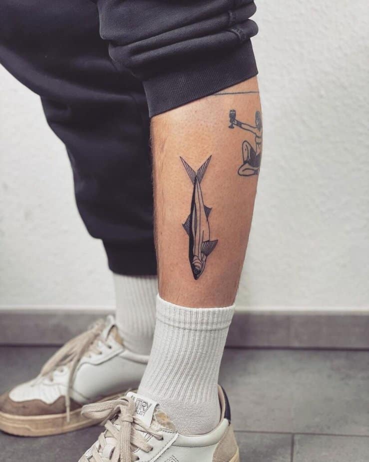 13. A blackwork fish tattoo