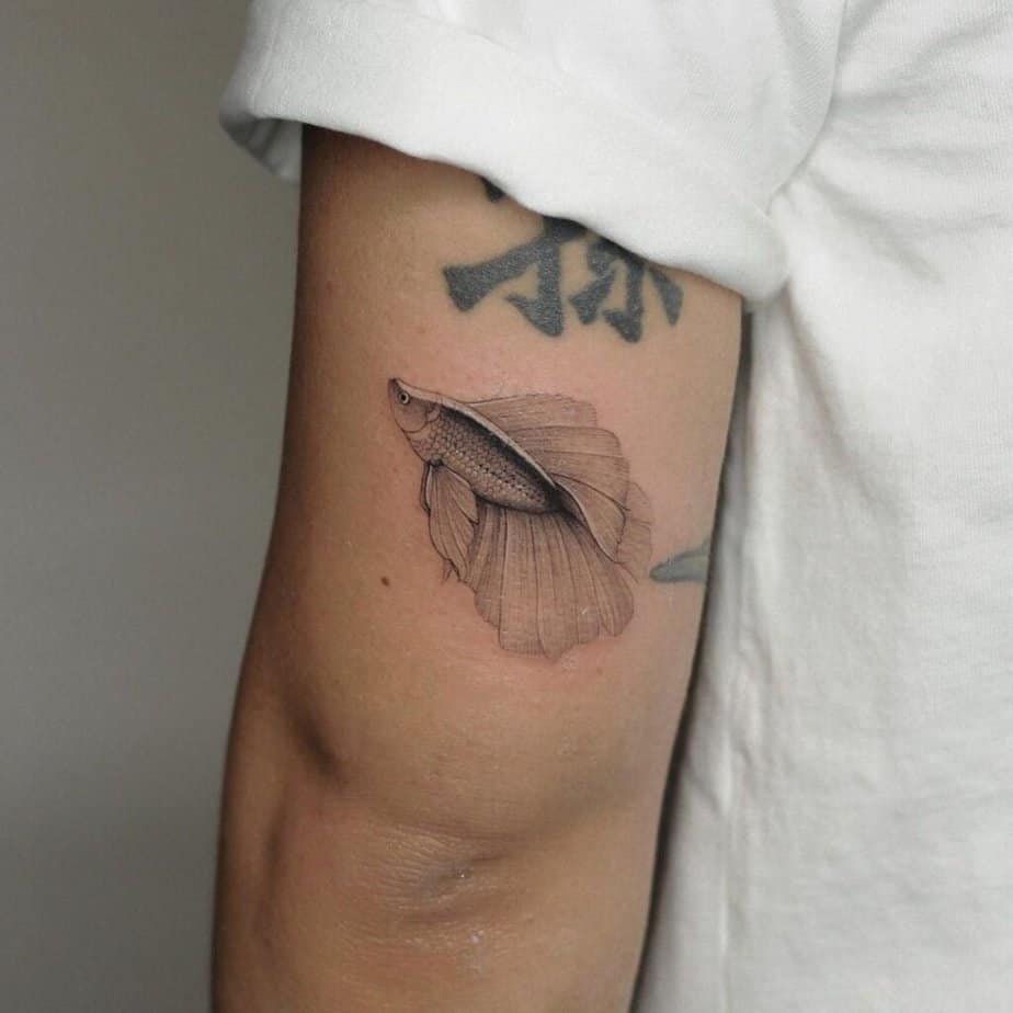 20. A Betta fish tattoo on the back of the arm