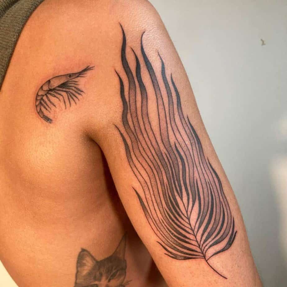5. A small shrimp tattoo on the back of the shoulder