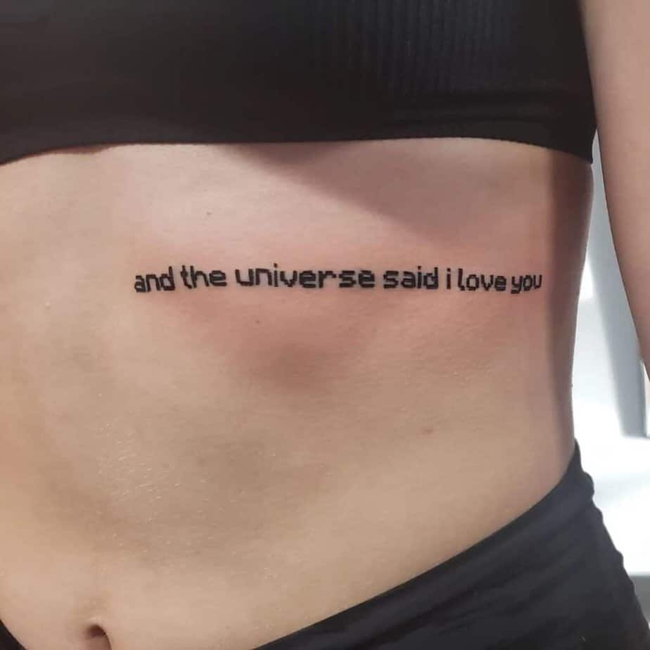 Minecraft-inspired quote tattoo on ribcage