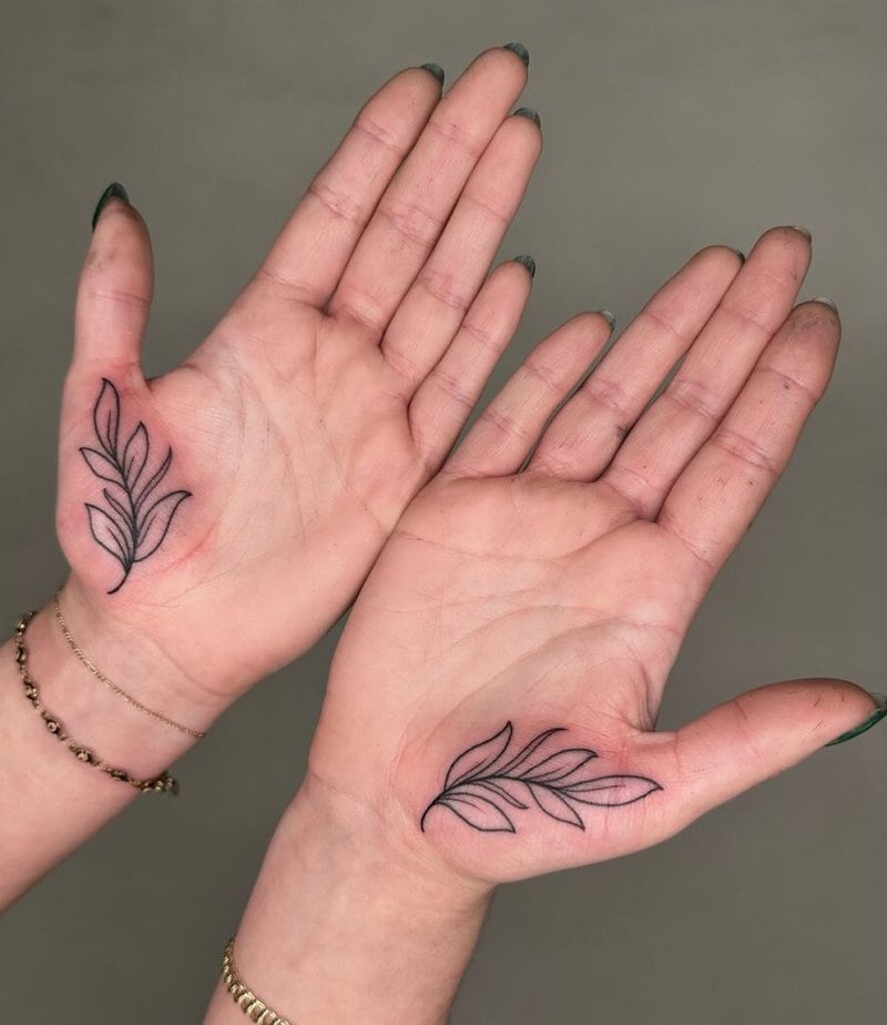 Symmetric leaf palm tattoos