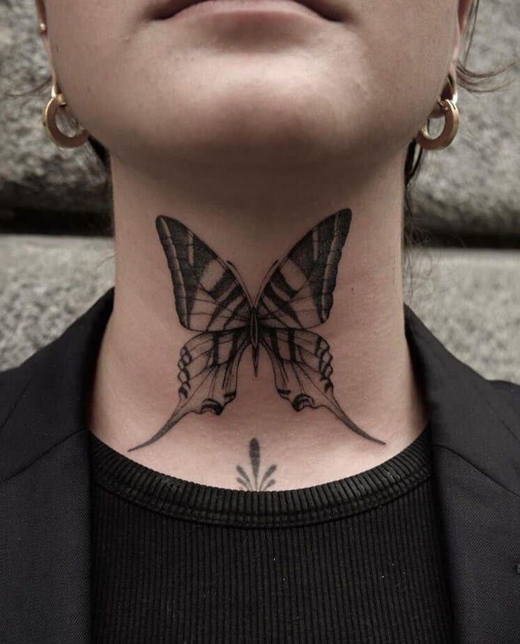 14. A statement butterfly neck tattoo 