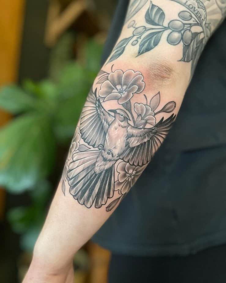 13. A Hunger Games patchwork tattoo sleeve 