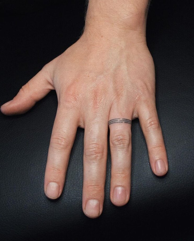 21. Simple yet lovely wedding ring tattoos