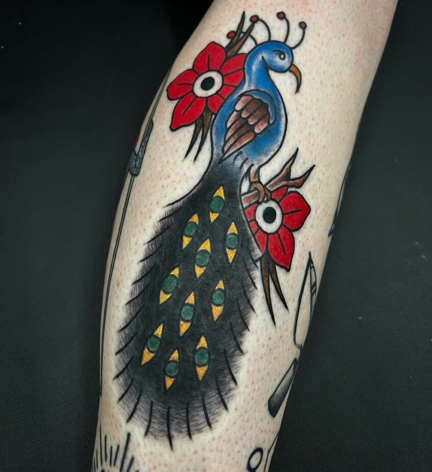 1. A peacock among red flowers